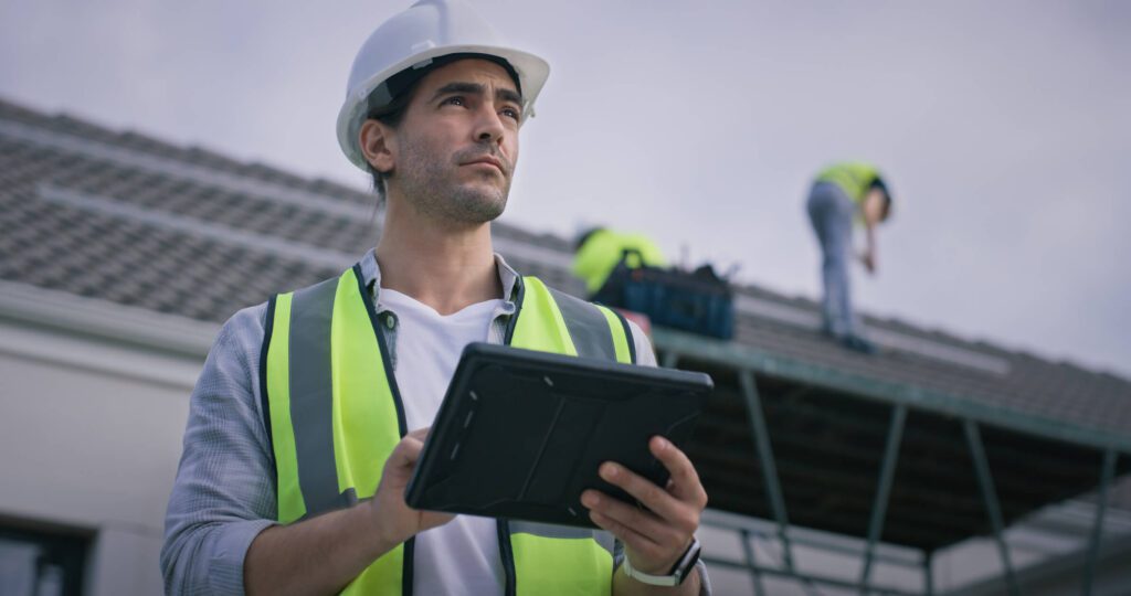 Commercial construction manager reviewing a job site for a new construction inspection