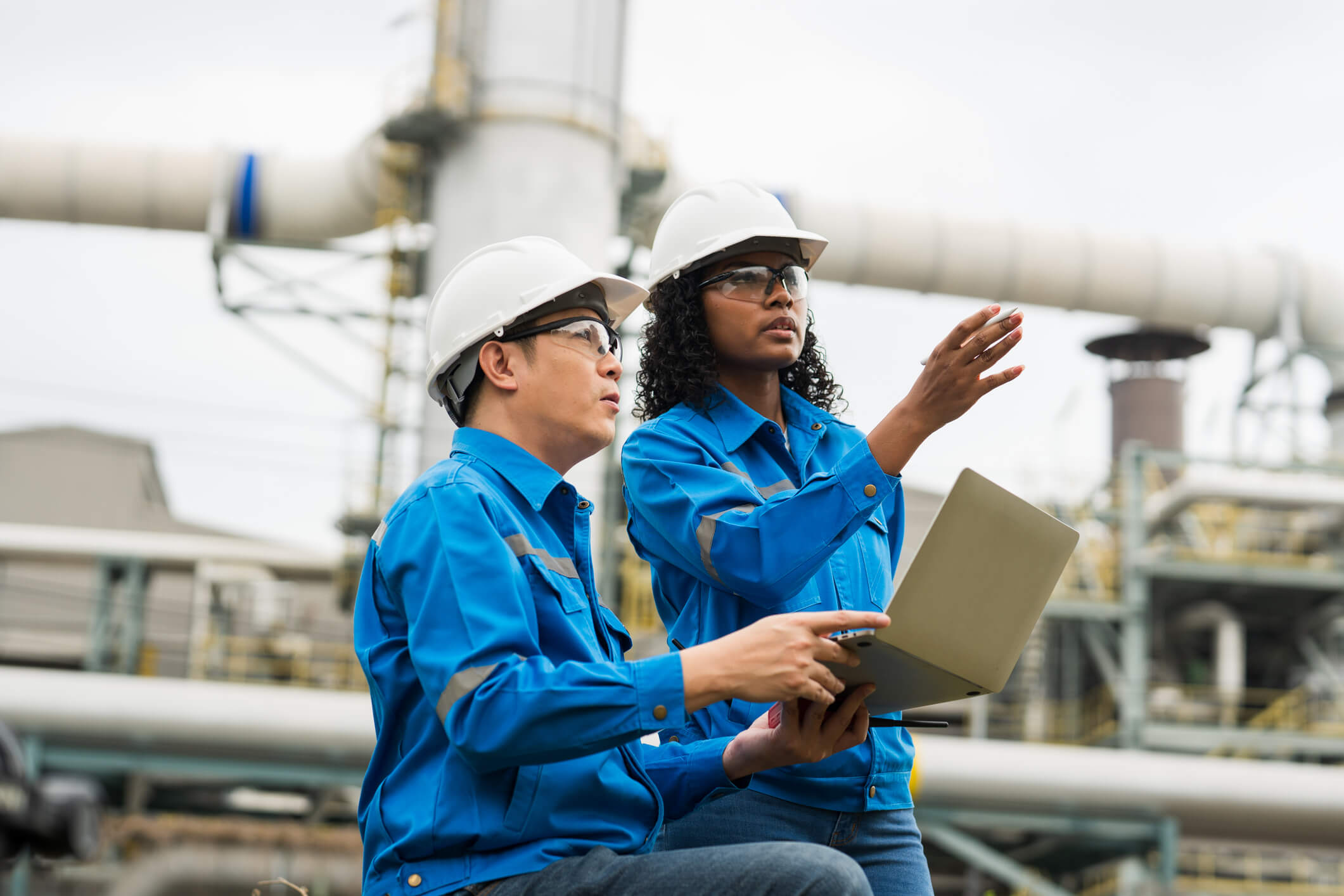 Commercial inspectors performing a virtual inspection at an industrial site