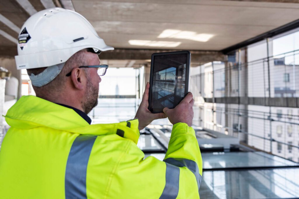 Commercial property inspection conducted by a contractor using a tablet for a virtual inspection