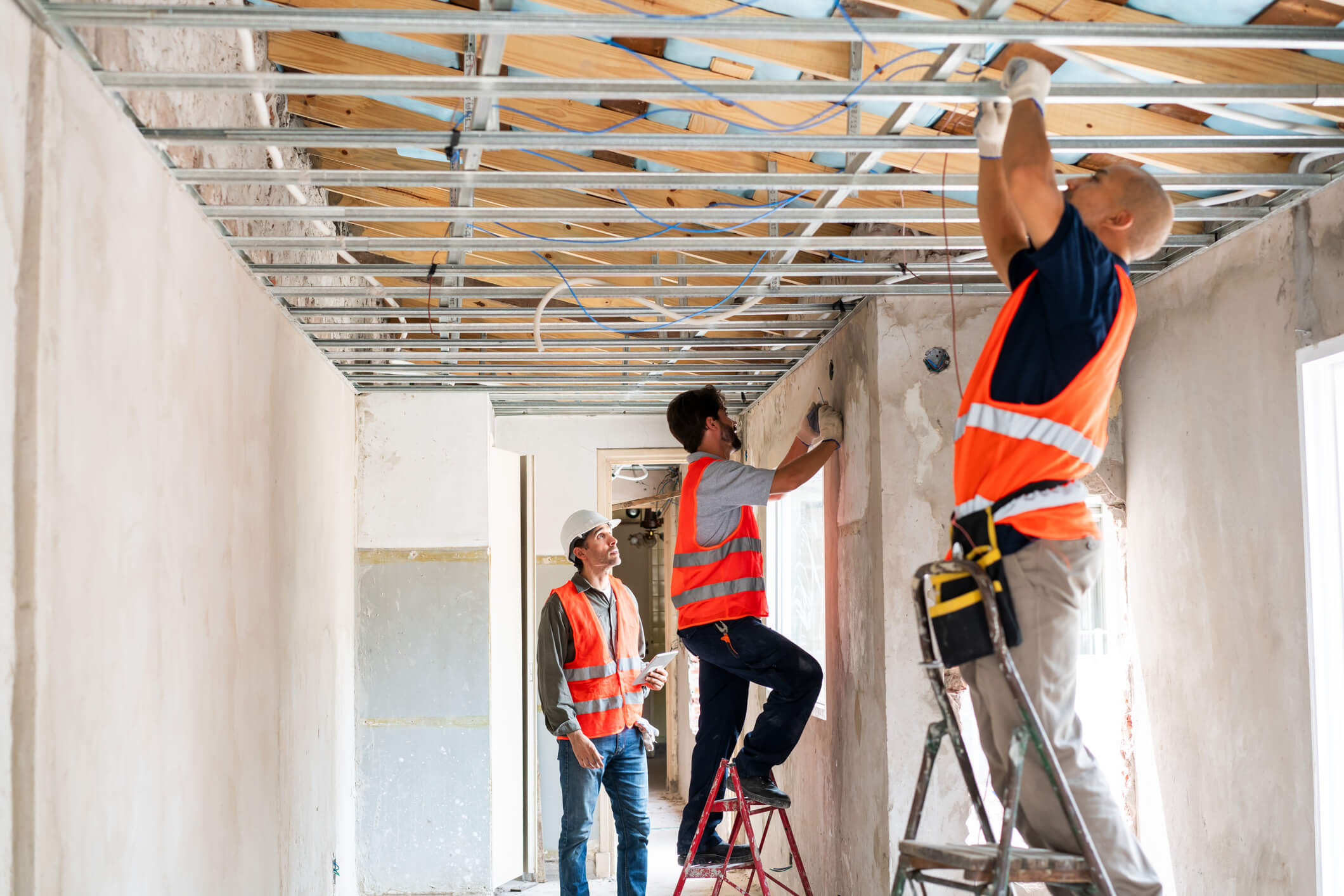 A commercial construction crew is conducting pre-construction verification to prevent construction rework.